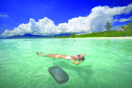 Woman in bikini relaxing lying on water against the backgrou